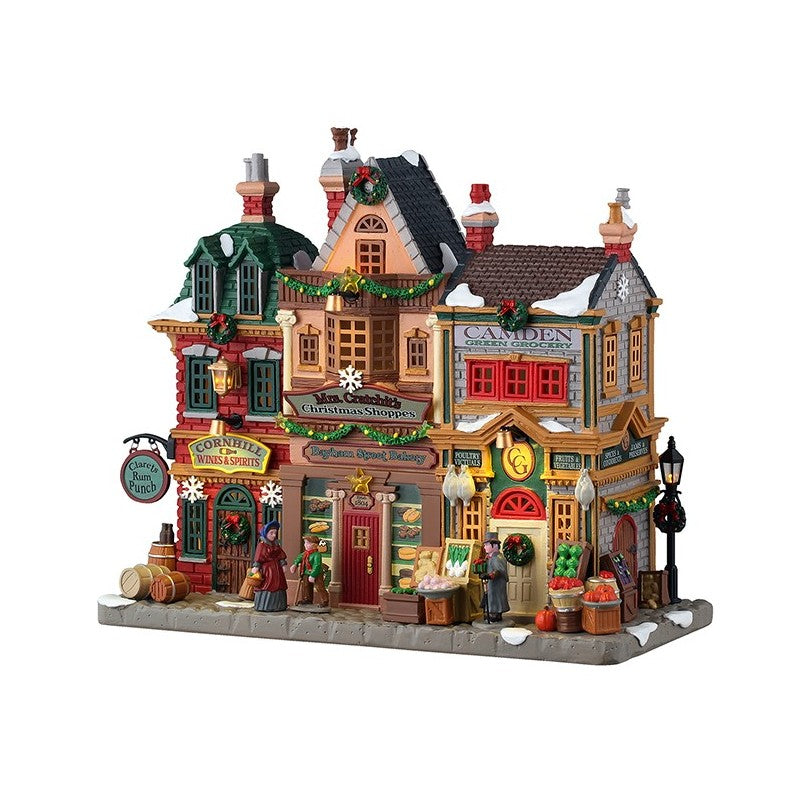 Mrs. Cratchit's Christmas Shoppes Lemax edificio vittoriano a più piani con negozi illuminati Camden Greengrocery e Cornhill Wine Spirits del Villaggio Natale Lemax | Dematteis.it