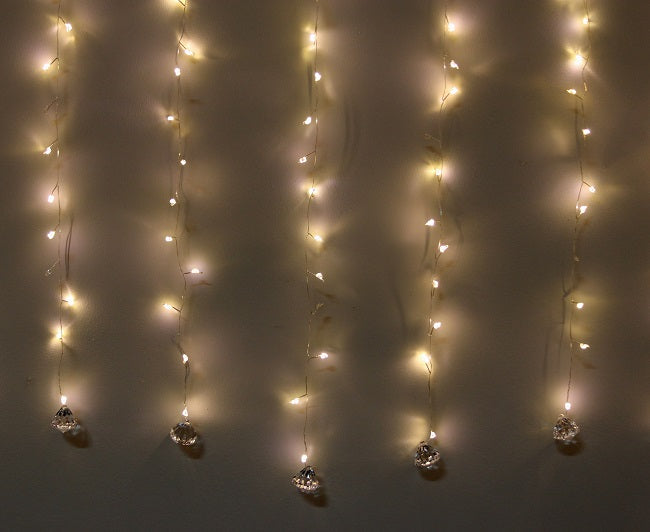 Tenda luminosa 6 x 1,2 m con 960 LED bianco caldo e pietre decorative per illuminazione natalizia - DeMatteis.it