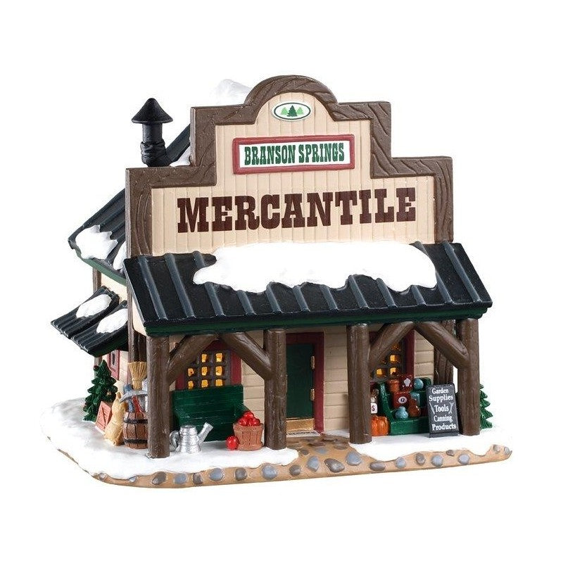 Branson Springs Mercantile Lemax, negozio di giardinaggio in miniatura per villaggio Lemax con facciata rustica, tetto verde innevato e illuminazione interna. | Dematteis.it