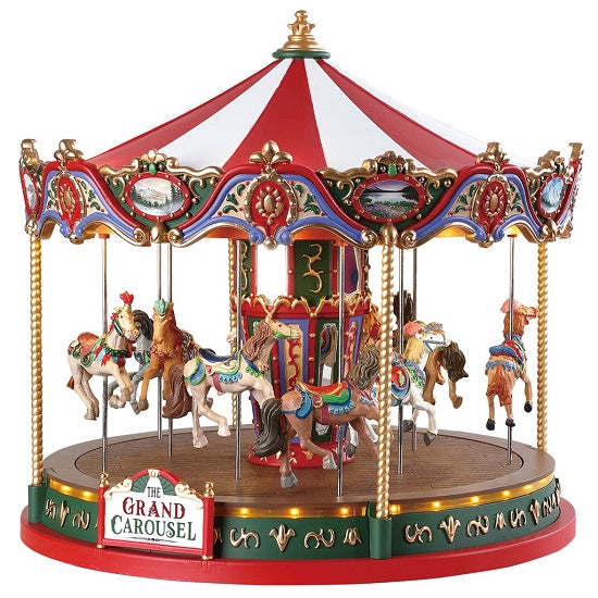 The Grand Carousel Lemax giostra dei cavalli con tetto rosso e bianco, cavalli colorati su base verde per villaggio di Natale Lemax | Dematteis.it
