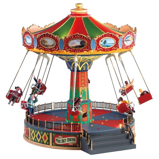 The Sky Swing Lemax: Giostra delle Altalene colorata con tetto rosso e verde, personaggi in miniatura sulle altalene e dettagli dorati per Villaggio di Natale Lemax | Dematteis.it