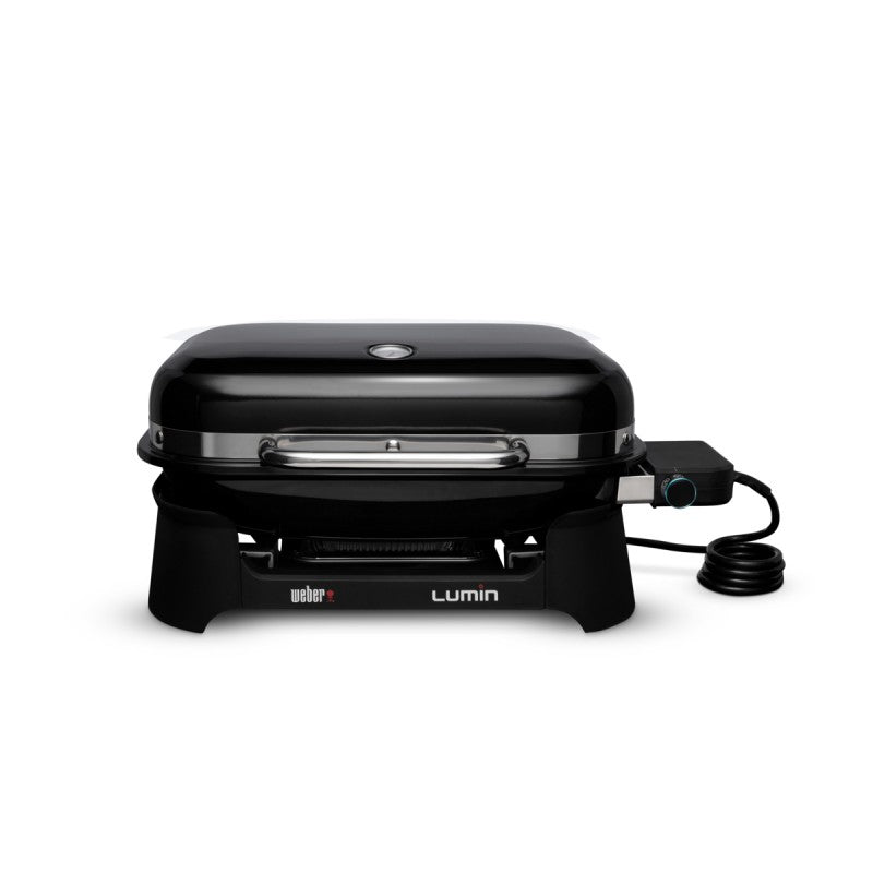 Weber barbecue elettrico Lumin con coperchio nero lucido, design compatto e moderno, ideale per spazi urbani ridotti, dotato di griglie in ghisa smaltata e sistema di controllo della temperatura per grigliate perfette. | Dematteis.it