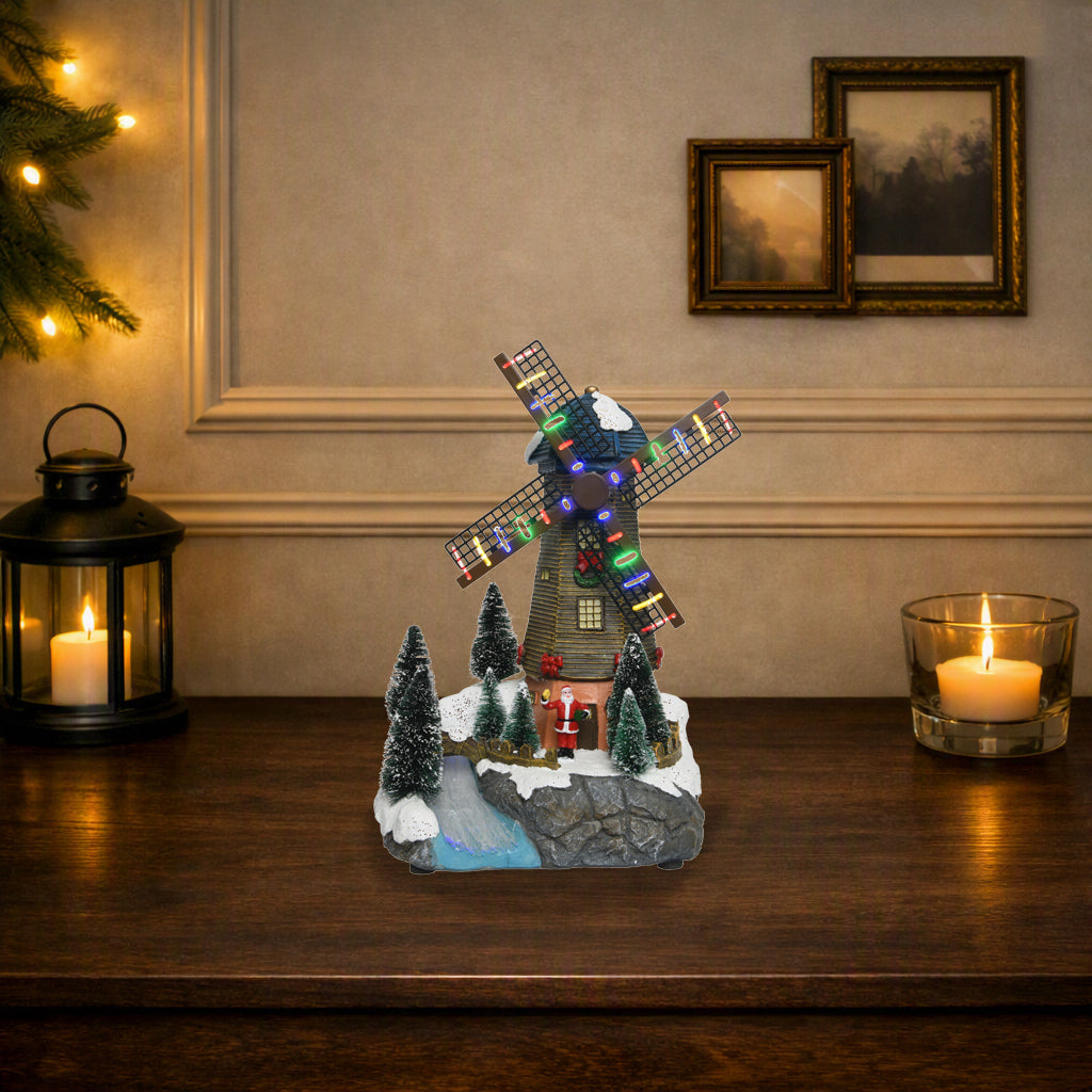 Kaemingk, Mulino a vento led con Babbo Natale, ambientazione natalizia Lemax con pale illuminate multicolore, alberelli innevati e base in resina scolpita a roccia con ruscello - DeMatteis.it