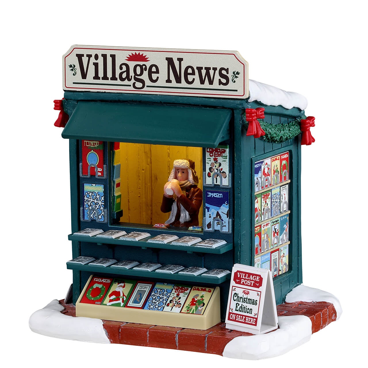 Good News Day Lemax - Edicola Lemax verde con insegna Village News, personaggio che legge all'interno, scaffali con giornali e base innevata per Villaggio Lemax. | Dematteis.it