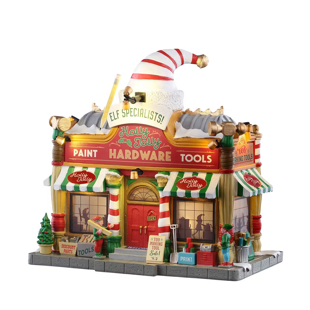 Holly Jolly Hardware Lemax negozio di attrezzi illuminato con cappello da elfo, insegne colorate e decorazioni natalizie per Villaggio di Natale Lemax. | Dematteis.it