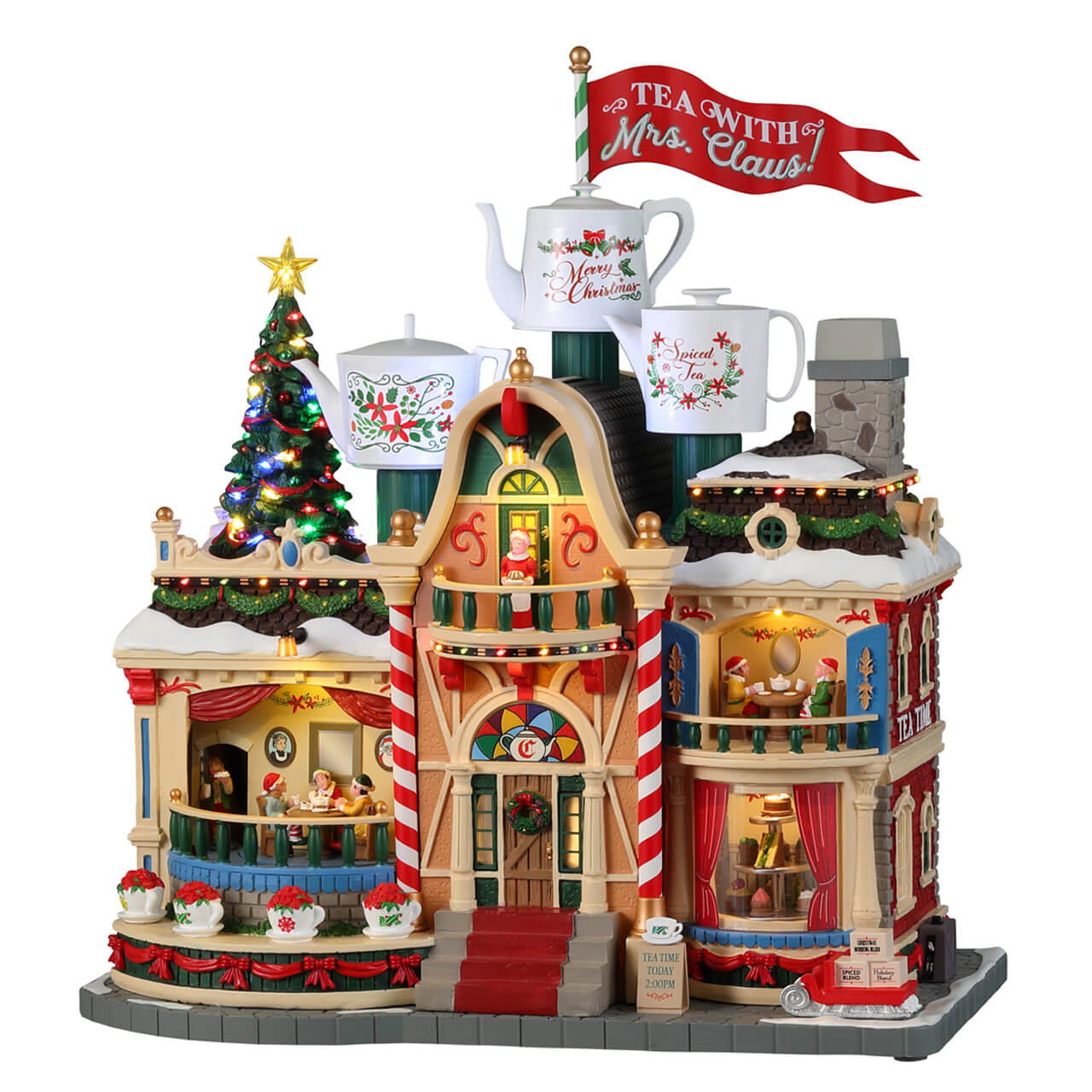 Tea With Mrs. Claus Lemax - Casa del Tè illuminata per Villaggio di Natale Lemax con architettura vittoriana, teiere decorative e albero natalizio laterale
 | Dematteis.it