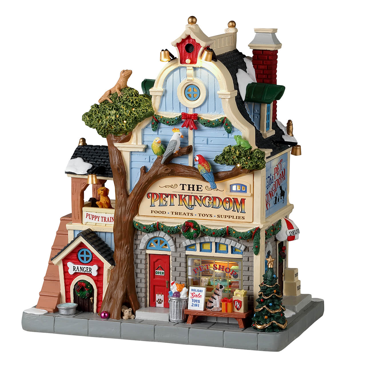 The Pet Kingdom Lemax, elegante Negozio per Animali del Villaggio natalizio con architettura vittoriana, decorazioni festive e colorati pappagalli sui rami. | Dematteis.it
