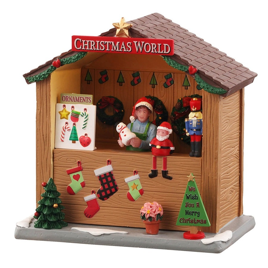 Christmas World Booth Lemax bancarella natalizia in legno con cassiere in cappello rosso, calze colorate, schiaccianoci e decorazioni per Villaggio Lemax. | Dematteis.it