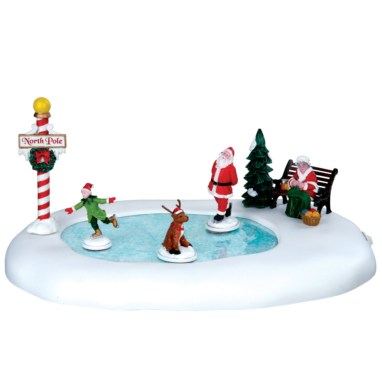North Pole Ice Follies Lemax con pista di Pattinaggio sul Ghiaccio, elfi e Babbo Natale che pattinano intorno al palo del Polo Nord decorato. | Dematteis.it